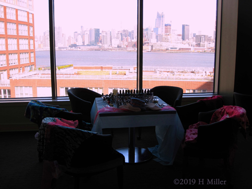 Assortment Of Spa Throws And Nail Polishes With City View Assortment Of Spa Throws And Nail Polishes With City View